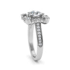 Three-quarter perspective of a 2 CT round lab diamond vintage floral halo engagement ring with milgrain pave band in 14K white gold.