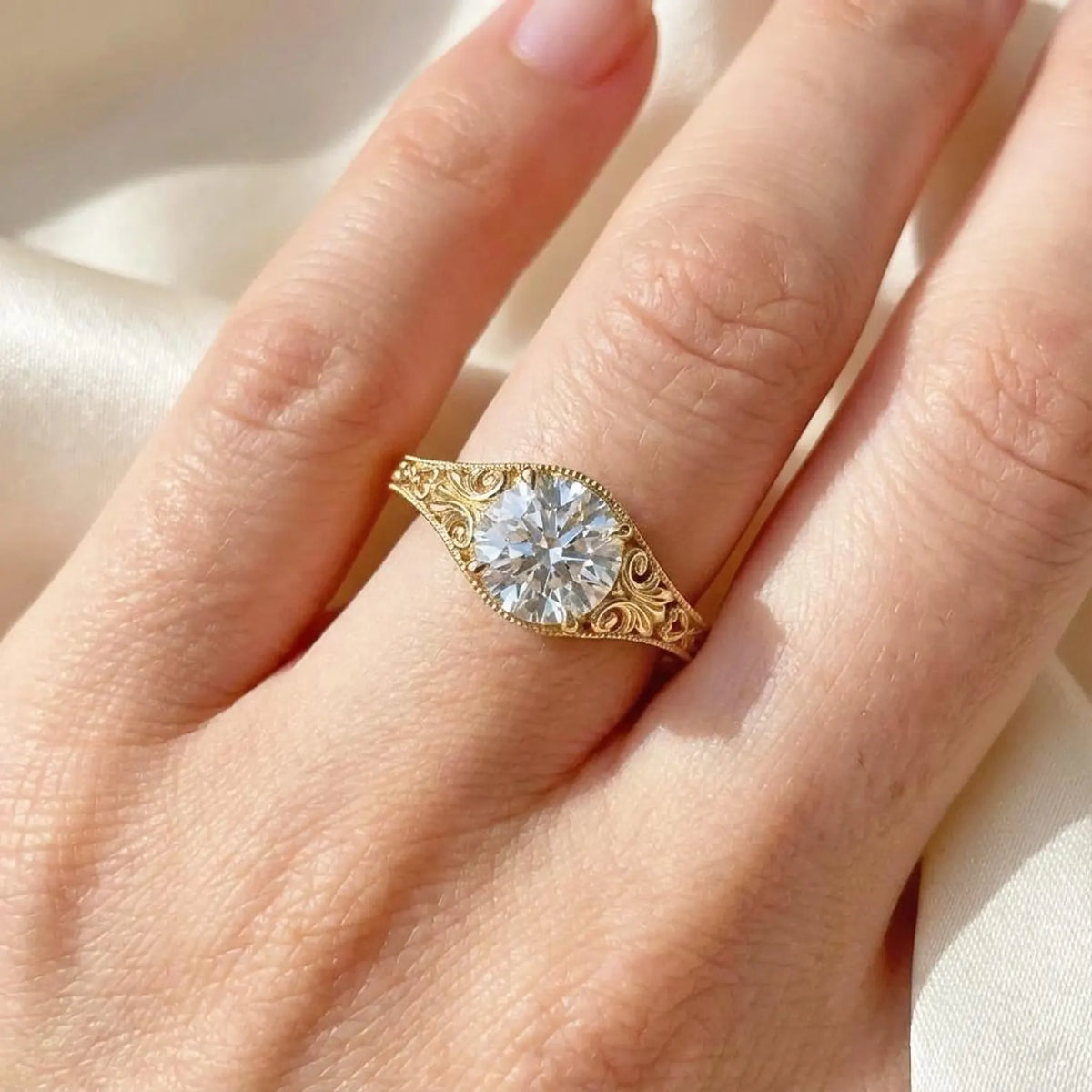 filigree-yellow-gold-round-diamond-ring-worn-on-hand