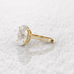 Close-up side perspective showing the intricate pave stone alignment along the gold band.