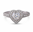 Front view highlighting the symmetrical heart-shaped center stone and surrounding diamond halo.