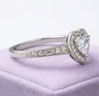 Side profile view displaying the detailed milgrain engraving and accent stones along the white gold band.