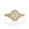 top-down-view-of-oval-cut-lab-grown-diamond-halo-engagement-ring-with-leaf-accents