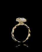 Profile view of a 4 carat oval lab grown diamond engagement ring with a hidden halo and twisted pavé band in yellow gold.
