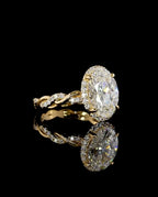 Horizontal side perspective of a 4ct oval lab diamond ring with a twisted infinity pavé band reflected on a dark background.