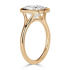 side-profile-of-cushion-cut-lab-grown-diamond-bezel-ring-in-yellow-gold