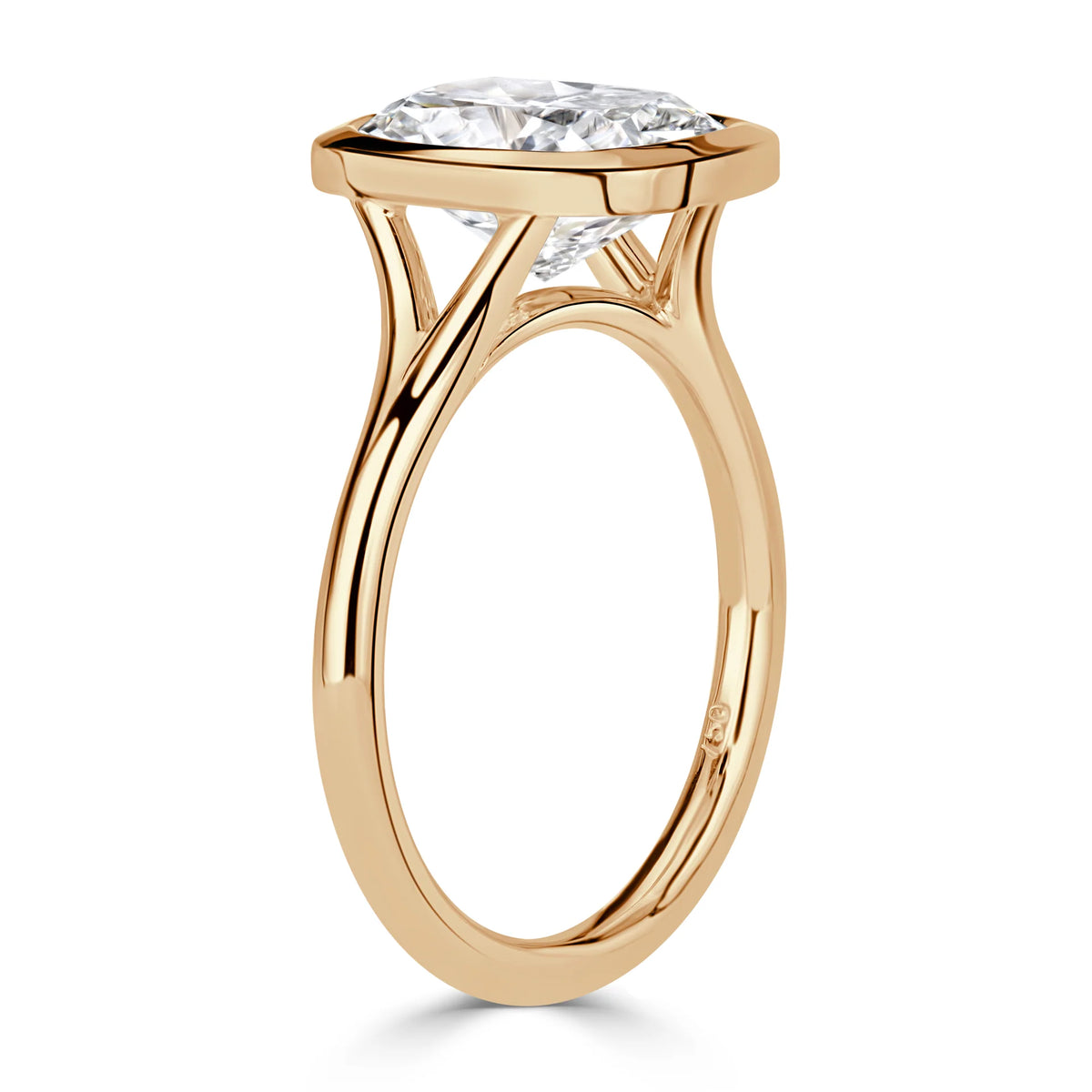 side-profile-of-cushion-cut-lab-grown-diamond-bezel-ring-in-yellow-gold
