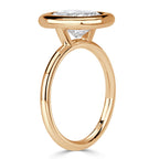 side-profile-of-cushion-cut-lab-grown-diamond-bezel-solitaire-ring-in-yellow-gold
