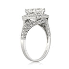 angled-profile-view-of-princess-cut-lab-diamond-halo-engagement-ring-in-white-gold