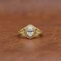 2-carat-oval-cut-lab-grown-diamond-bezel-set-engagement-ring-front-view