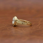side-profile-view-of-oval-cut-lab-diamond-ring-showing-antique-engravings