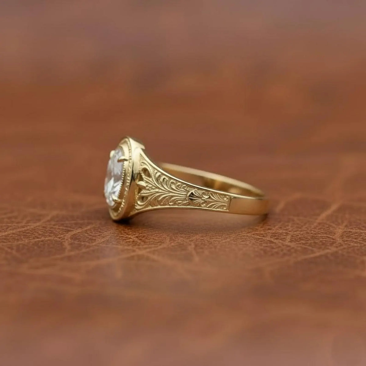 side-profile-view-of-oval-cut-lab-diamond-ring-showing-antique-engravings