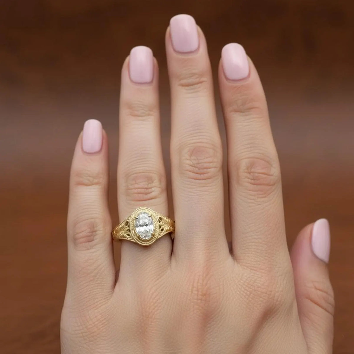 2ct-oval-lab-grown-diamond-bezel-ring-worn-on-hand-lifestyle-view