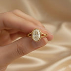 close-up-hand-held-view-of-oval-cut-lab-grown-diamond-engagement-ring