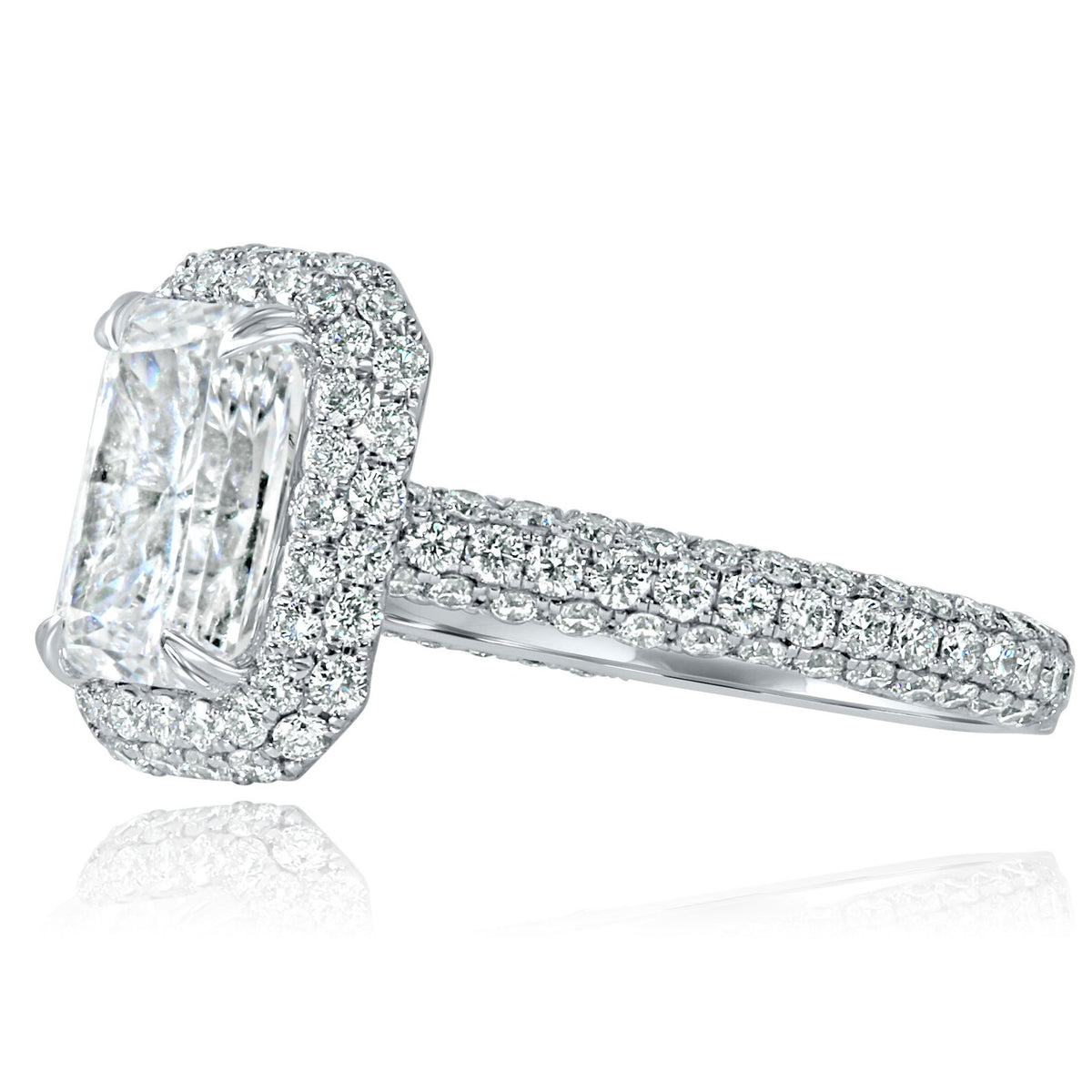 Top-down view of a 4 CT radiant cut lab-grown diamond framed by a double row halo and pave diamond shank.
