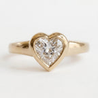 front-macro-view-of-heart-cut-lab-diamond-bezel-engagement-ring