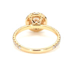 Bottom view of a 2 carat round lab-grown diamond halo ring displaying the polished inner band and four-prong basket structure.