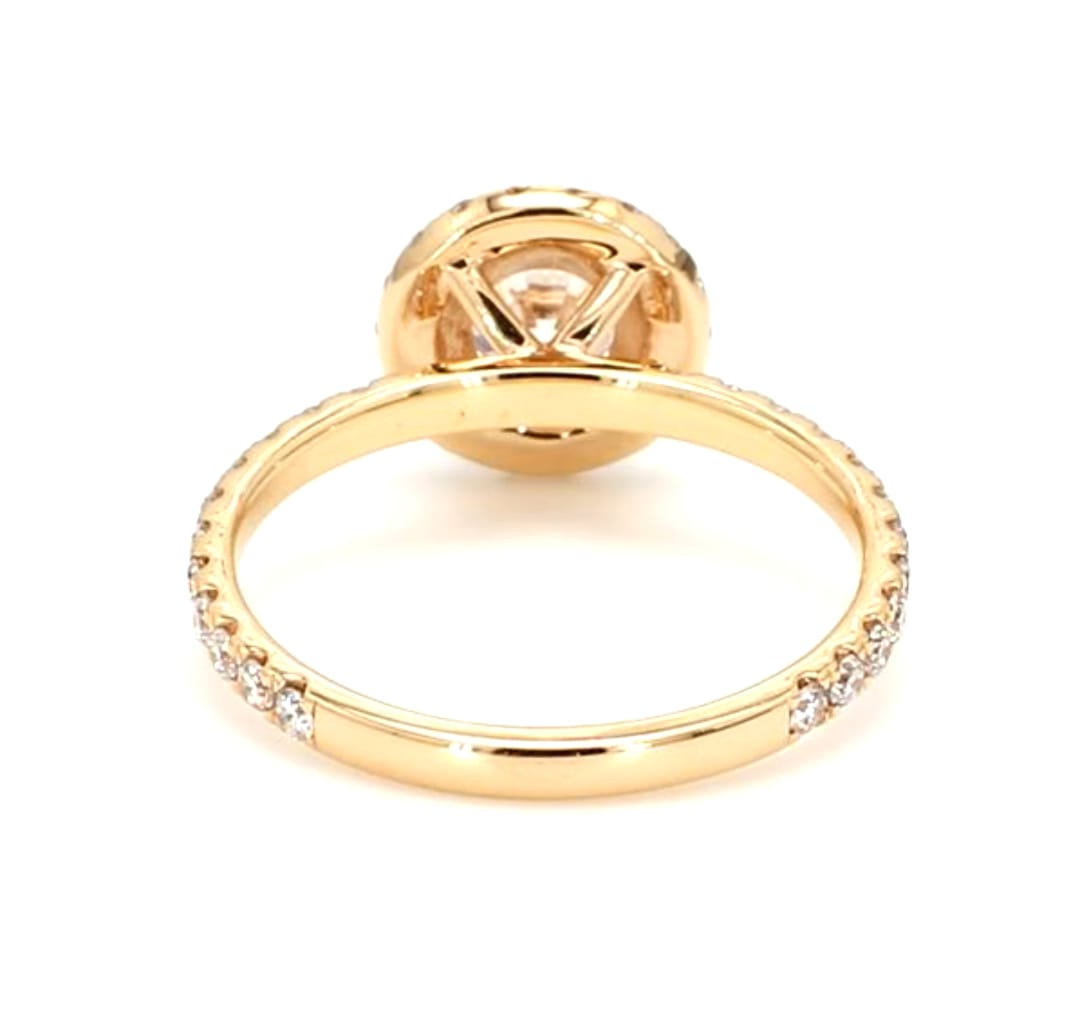 Bottom view of a 2 carat round lab-grown diamond halo ring displaying the polished inner band and four-prong basket structure.