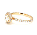 Angled view of a 2 Ct round brilliant lab diamond ring featuring a sparkling diamond halo setting with twisted rope detail and pavé shank.