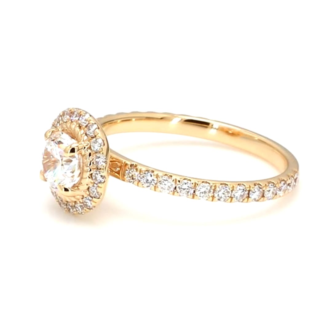 Angled view of a 2 Ct round brilliant lab diamond ring featuring a sparkling diamond halo setting with twisted rope detail and pavé shank.