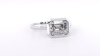 Side profile view of a 3 CT emerald cut lab-grown diamond engagement ring in a bezel setting.