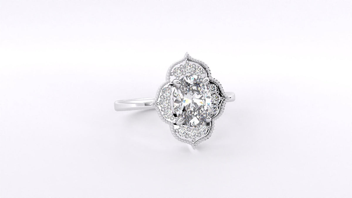 Angled side view of a 3 CT oval lab-grown diamond engagement ring featuring a vintage floral halo in white gold.