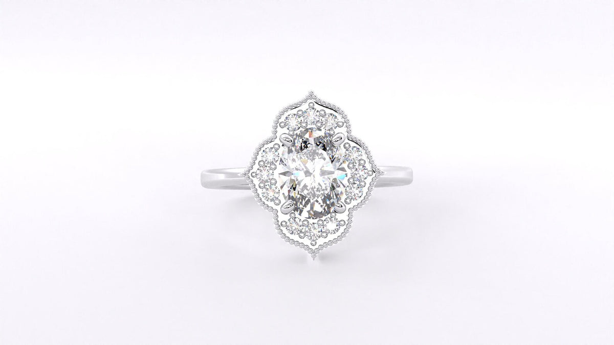 Top-down direct view of the intricate scalloped floral halo and milgrain details on an oval diamond ring.