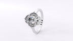 Perspective shot highlighting the polished white gold band and unique floral halo cluster of a 3 carat ring.