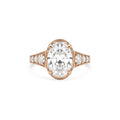 Top-down view of a 4 carat oval lab-grown diamond ring featuring side accent stones in romantic rose gold.