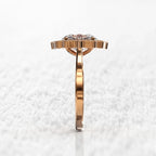 Low profile side view highlighting the gallery and setting of a 3 carat oval lab-grown diamond ring.