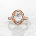 Direct top-down view of a 3 CT oval cut lab-grown diamond with an antique scalloped halo in rose gold.