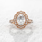 Direct top-down view of a 3 CT oval cut lab-grown diamond with an antique scalloped halo in rose gold.