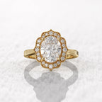 Overhead display of an antique-inspired 3 CT oval cut lab-grown diamond ring styled in yellow gold.