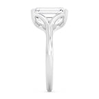 Side profile view showcasing the setting of a 4 carat emerald cut lab-grown diamond ring in white gold.