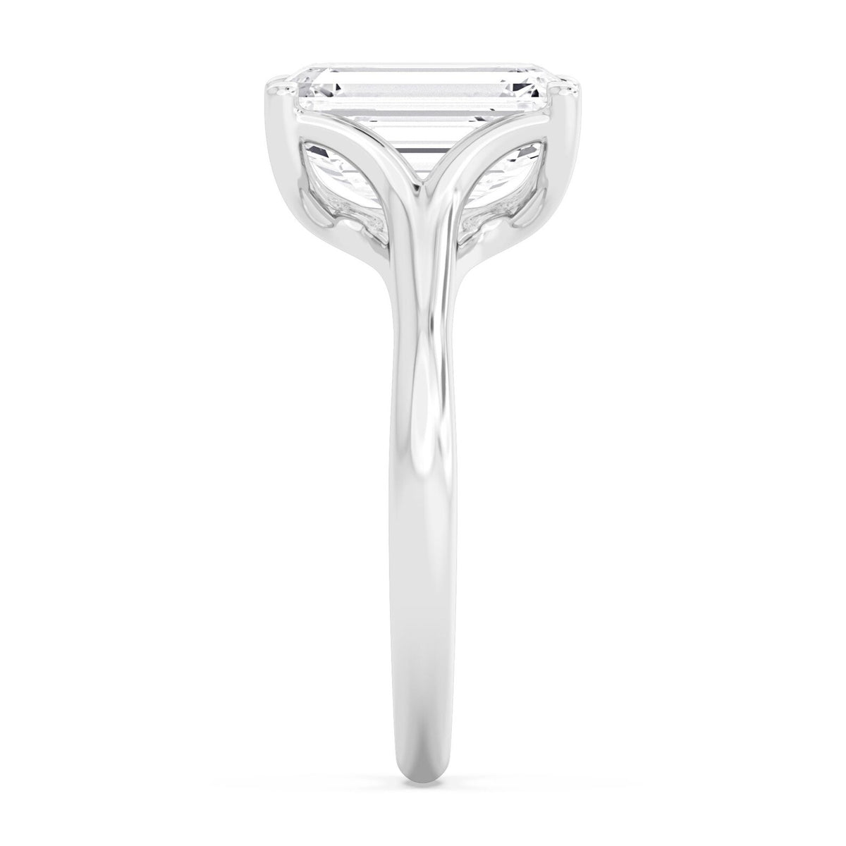 Side profile view showcasing the setting of a 4 carat emerald cut lab-grown diamond ring in white gold.