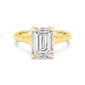 Top-down overhead view of a 4 CT emerald cut lab-grown diamond solitaire ring in yellow gold.