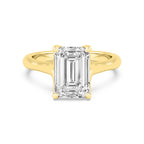 Top-down overhead view of a 4 CT emerald cut lab-grown diamond solitaire ring in yellow gold.