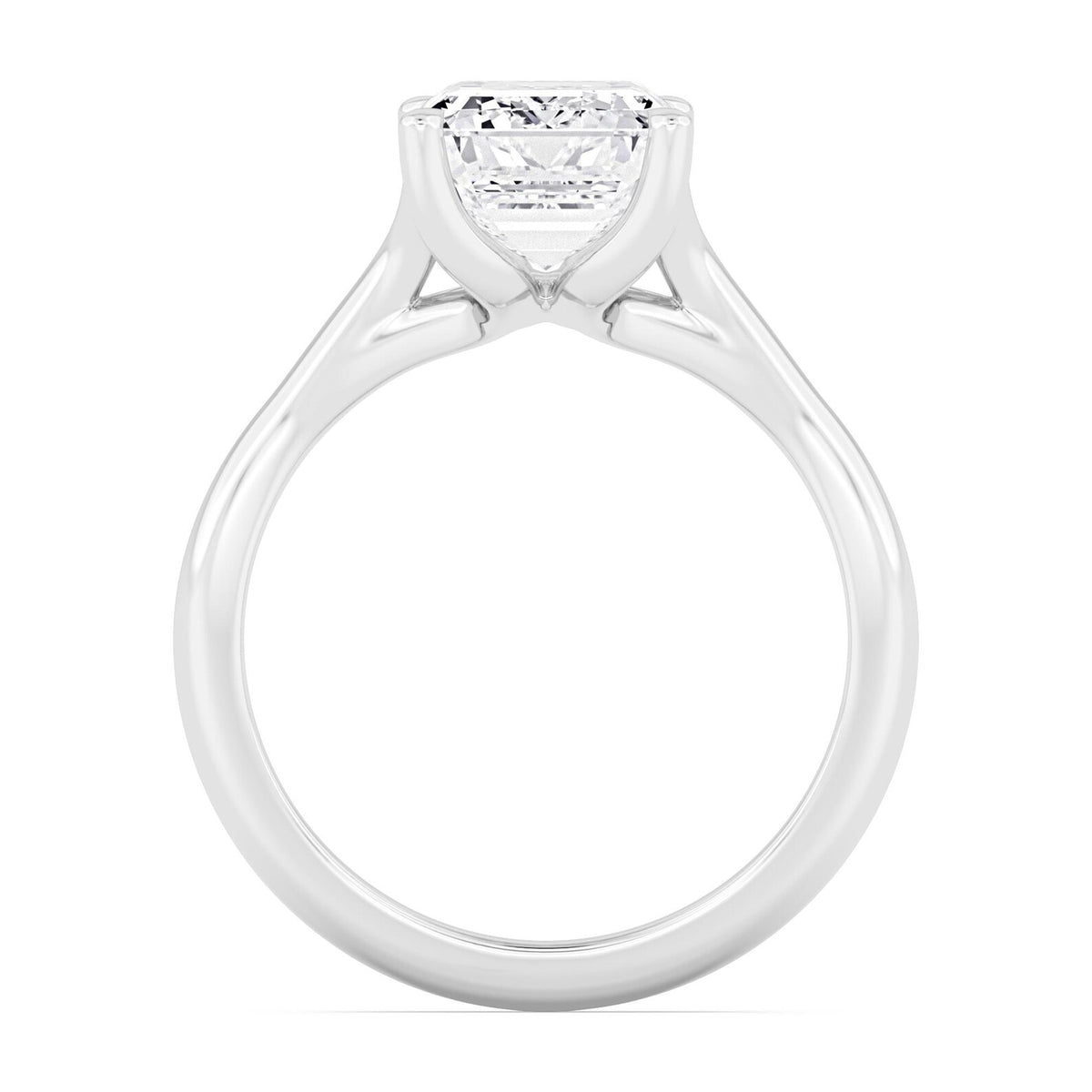 Close-up side profile view highlighting the gallery basket and prongs of a white gold emerald diamond ring.