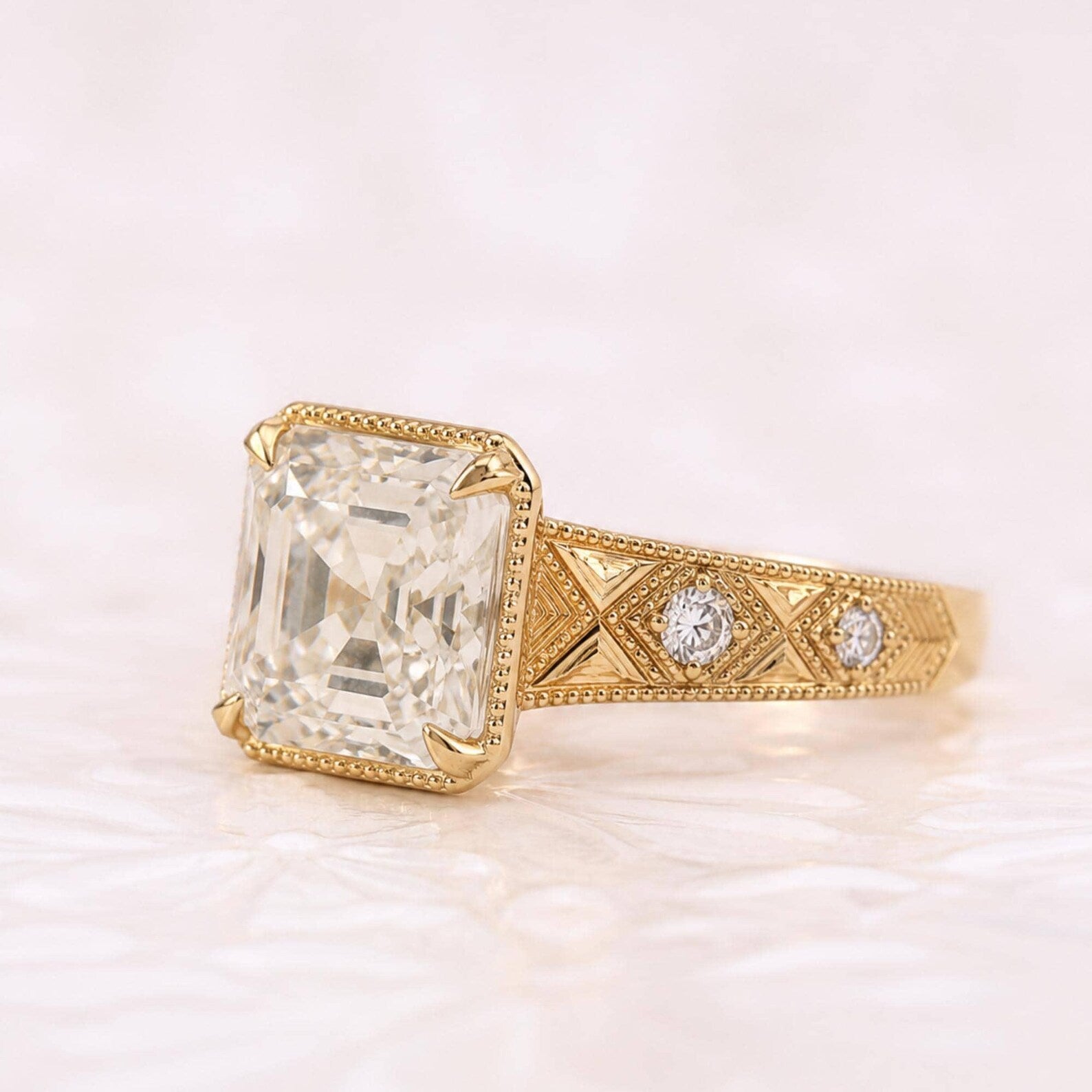 Asscher Cut hand-engraved chevron pattern band set with bezel round accent diamonds.