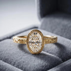 3 carat oval lab-grown diamond bezel ring nestled in a grey velvet jewelry box.