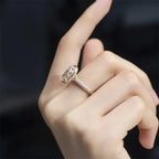 Person wearing a 3 carat oval lab diamond engagement ring in yellow gold with a sparkling diamond pavé band.
