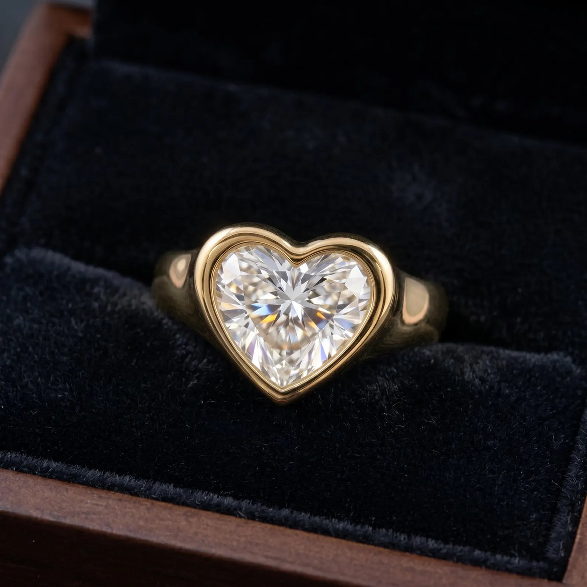 3 CT heart lab-grown diamond bezel engagement ring presented in a wooden box with black velvet interior.
