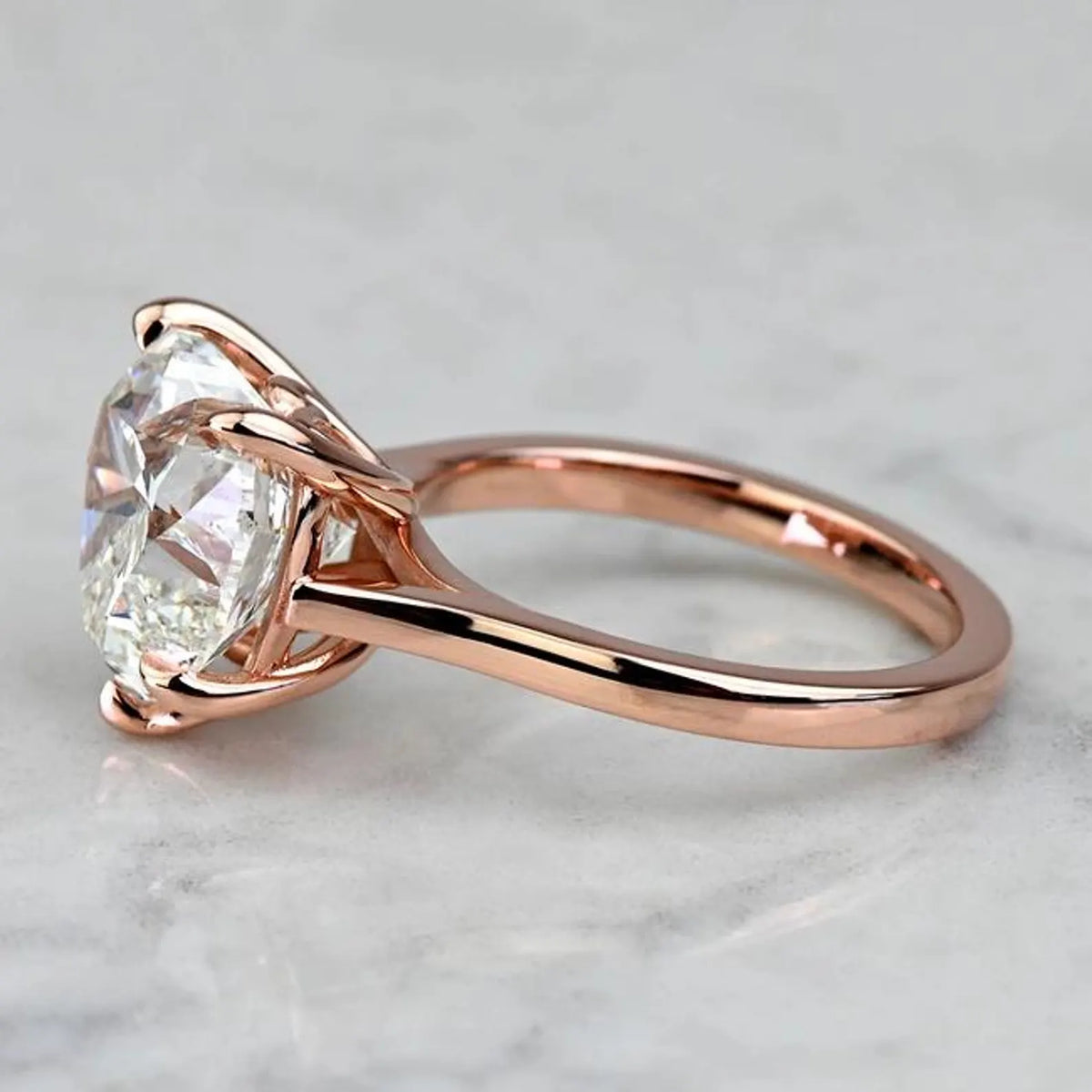 Side view of a 3 CT heart lab diamond ring showing the smooth 14K rose gold band and cathedral shoulders.