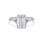 Top front view of a 4 CT emerald cut lab-grown diamond engagement ring with a split shoulder cathedral band in 14K white gold.