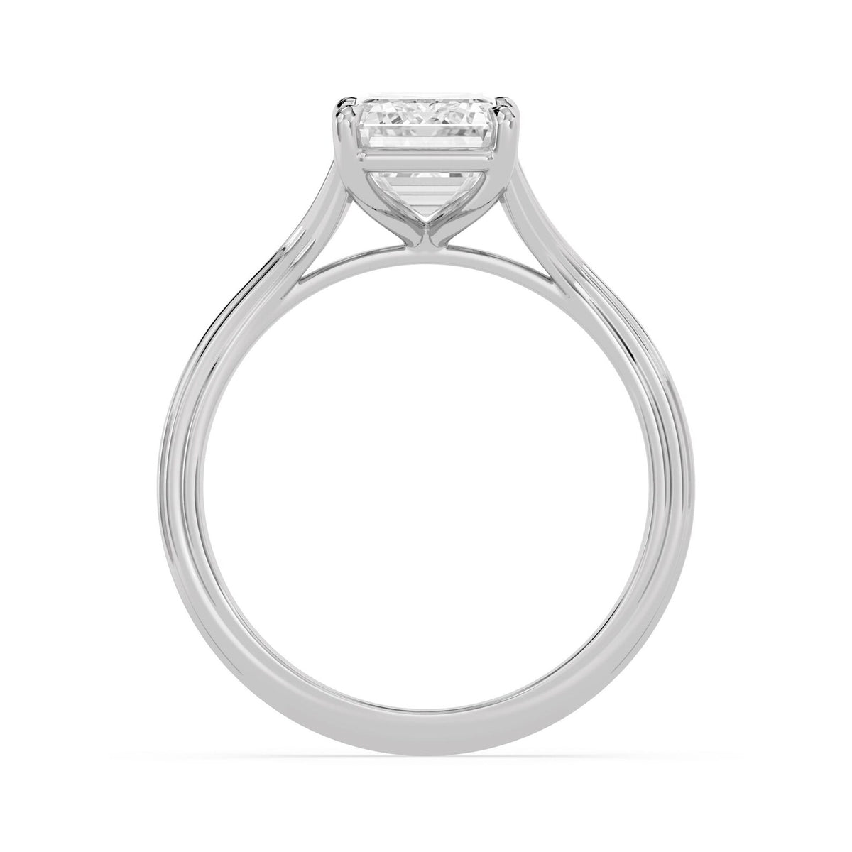Side profile view of a 4 carat emerald cut lab diamond engagement ring showing the cathedral basket setting in white gold.