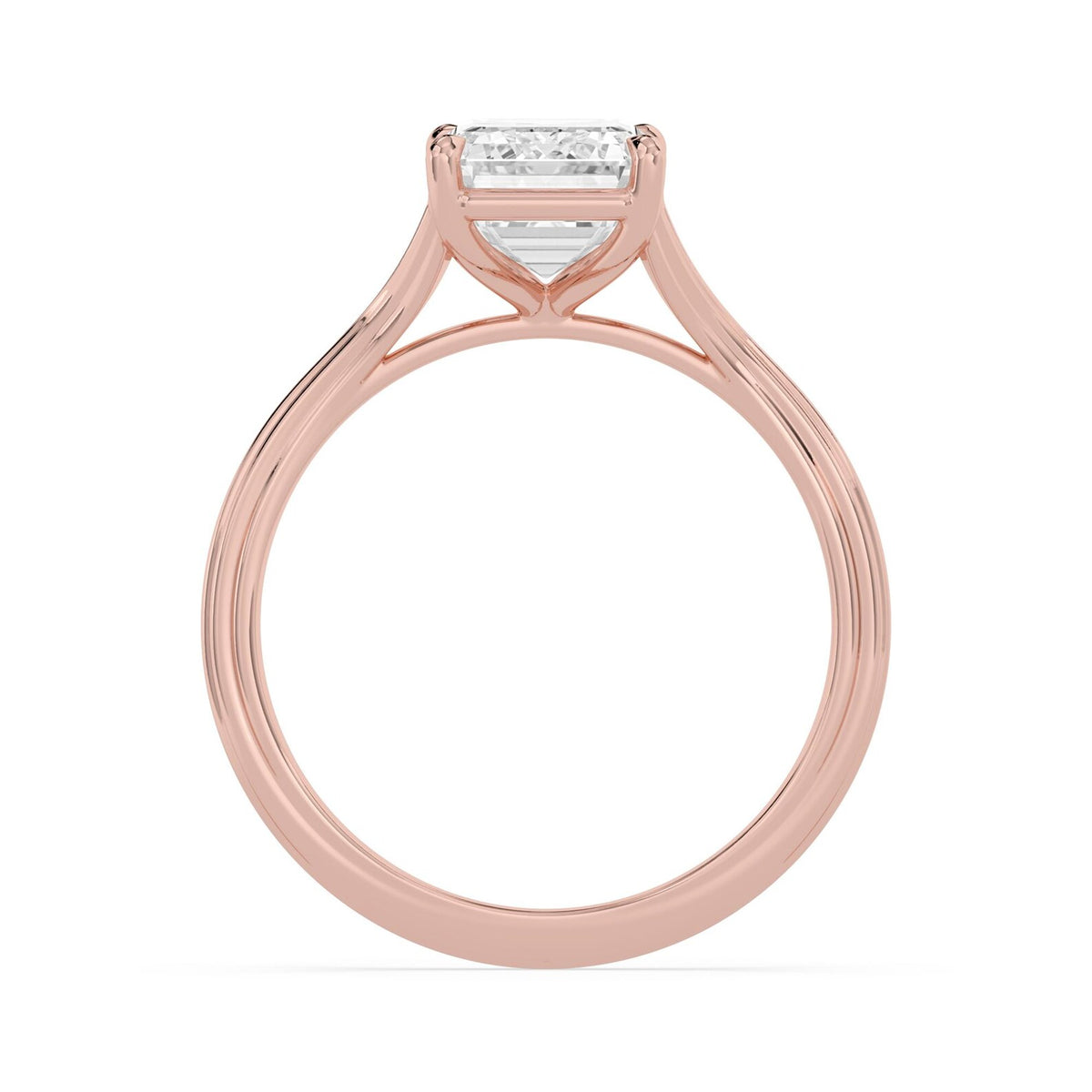 Side profile view of a 4 CT emerald cut lab-grown diamond ring in 14K rose gold with an open gallery basket setting.