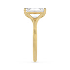 Side view of a 4 CT emerald cut lab diamond ring in yellow gold demonstrating the grooved split band detailing.