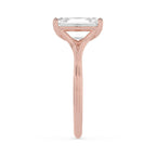 Side profile view of a 4 CT emerald cut lab diamond engagement ring in rose gold with polished band contours.