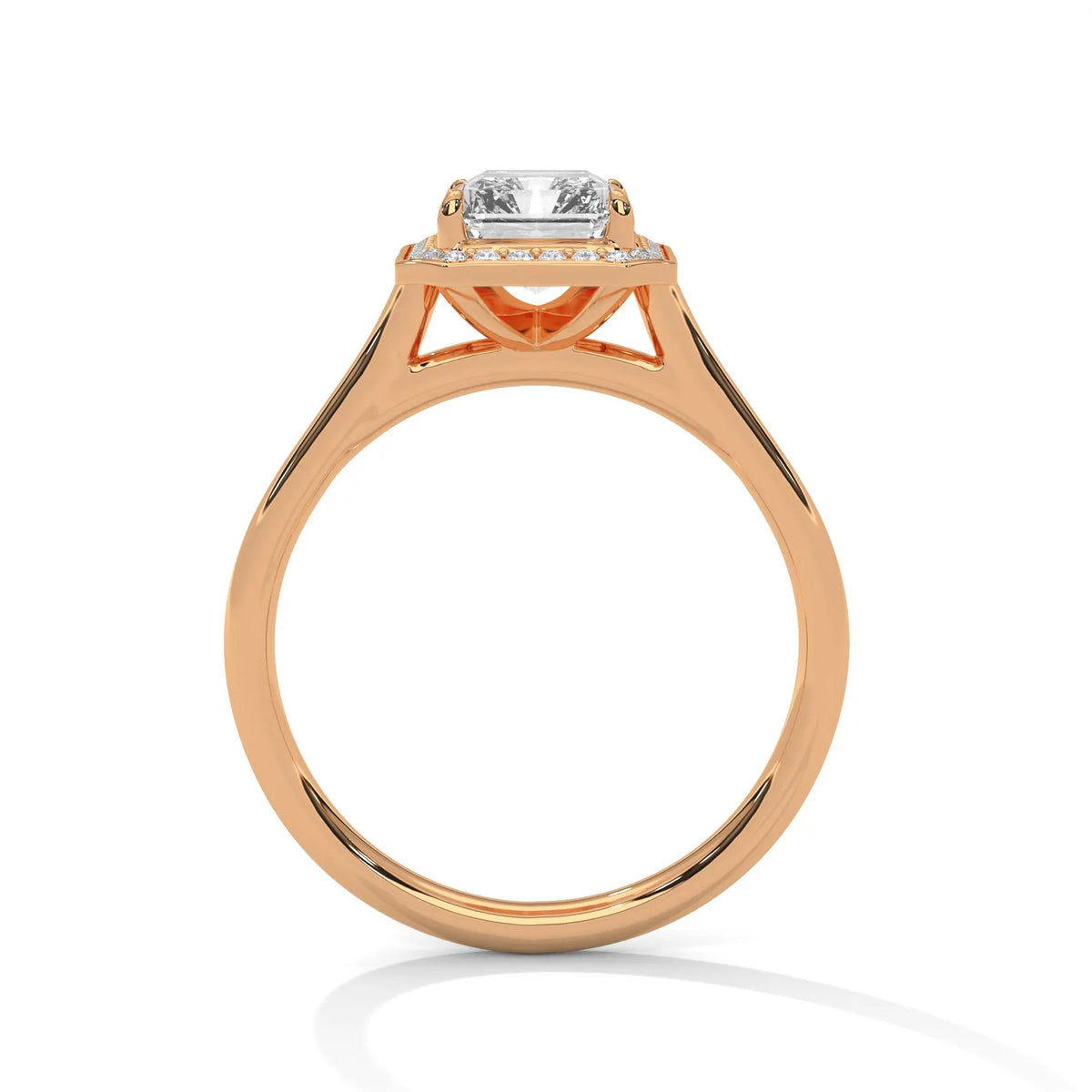 Side profile view showing the elevated cathedral basket of a 4 CT emerald cut lab diamond ring in 14K rose gold.