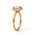 Angled side view of a 4 CT emerald cut lab-grown diamond engagement ring on a plain rose gold band.