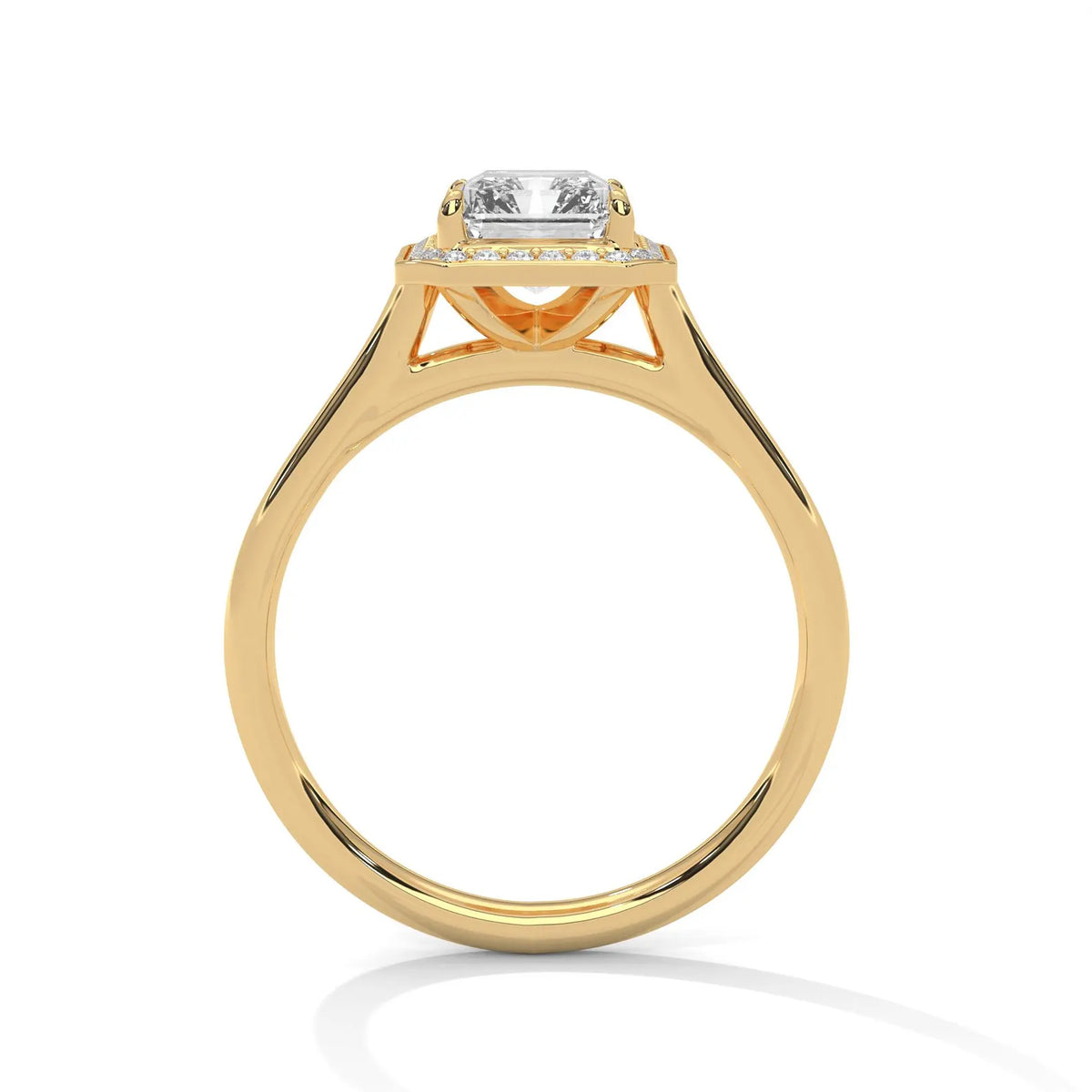 Side profile view showing cathedral bridge setting of a 4 CT emerald cut lab diamond solitaire ring in yellow gold.